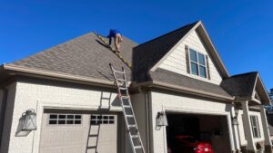 Godfrey Roofing. Roof Inspection With Ladder.