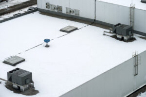 commercial roofing. commercial roof full of snow.